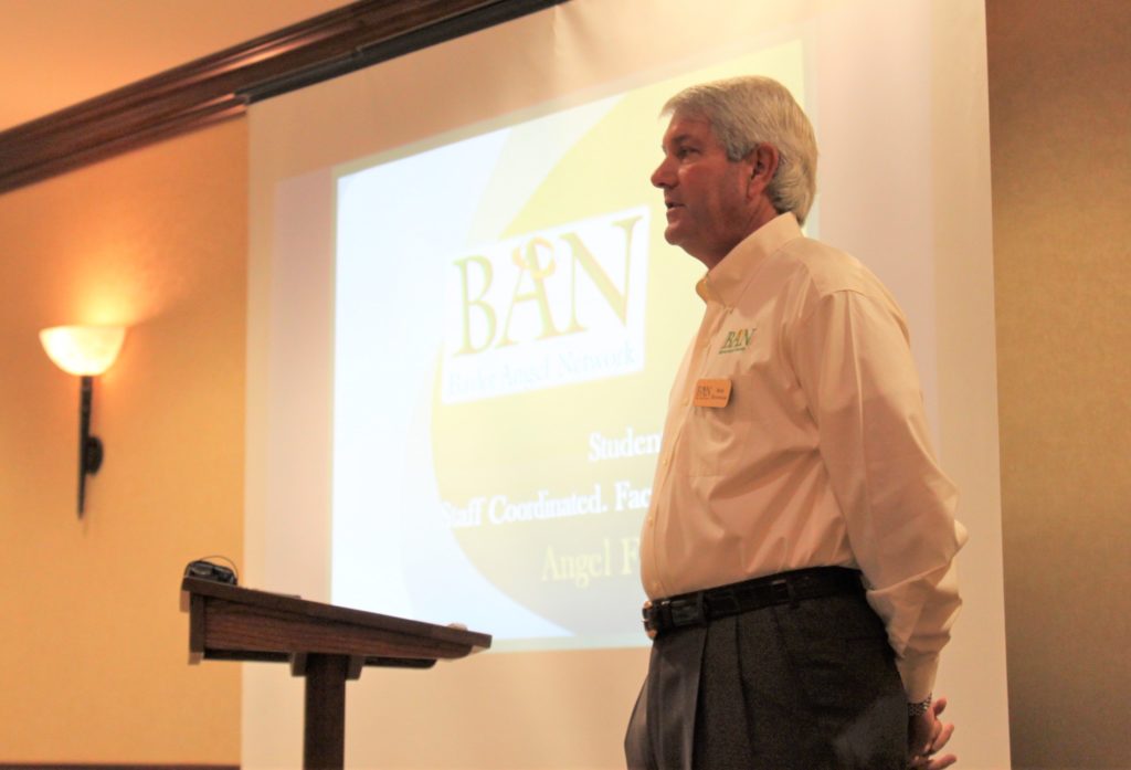 Photo of Bob Brewton speaking at a podium